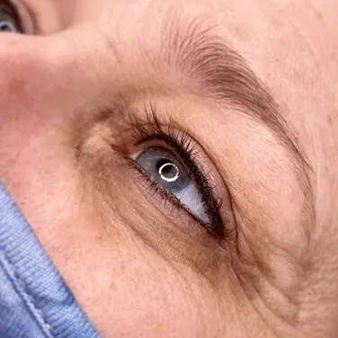 A close up of an older person 's eye
